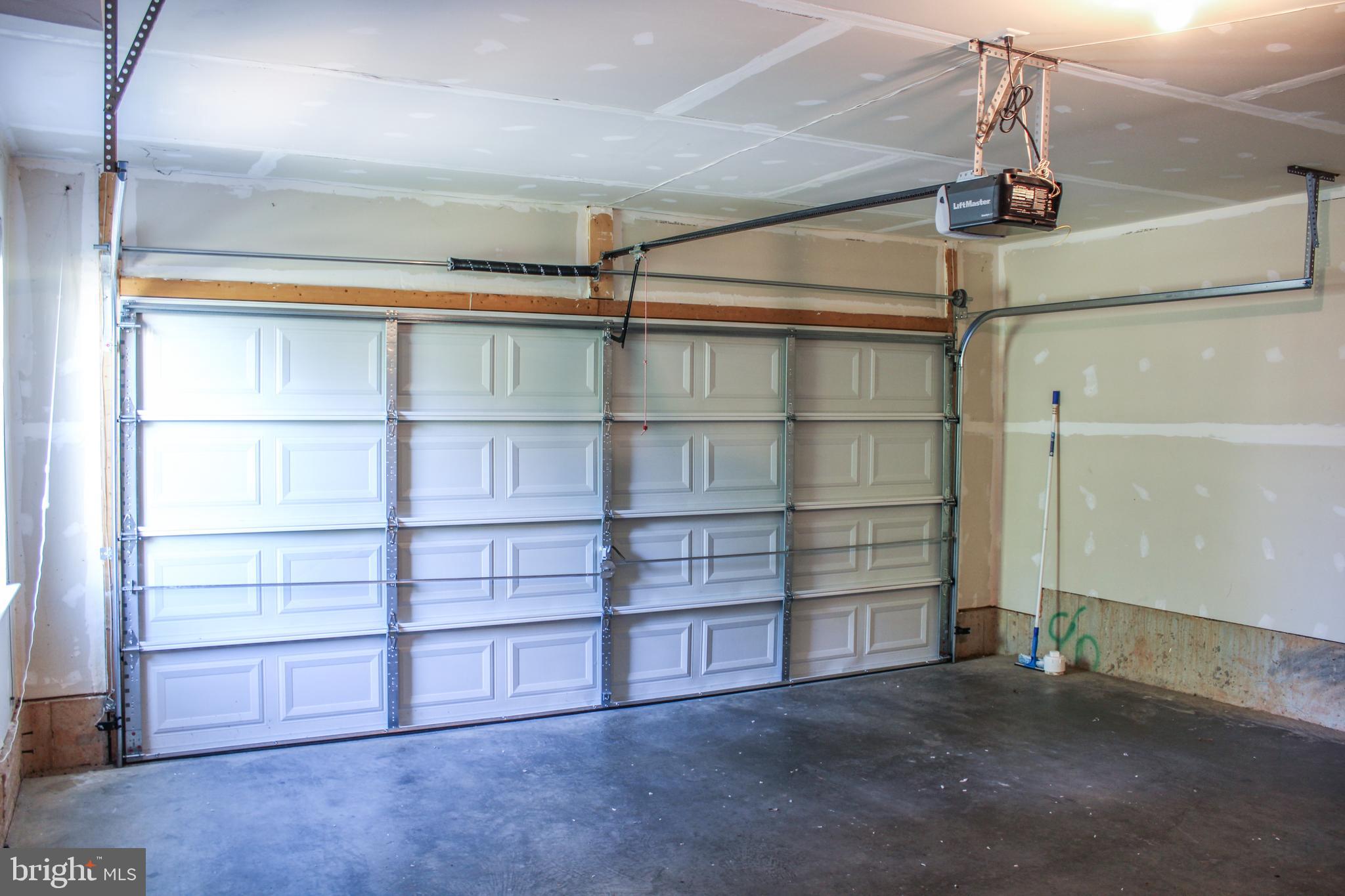 9914 Wood Edge Way Lanham, MD 20706 - Photo 5 of 67 a view of an empty room with empty shelves