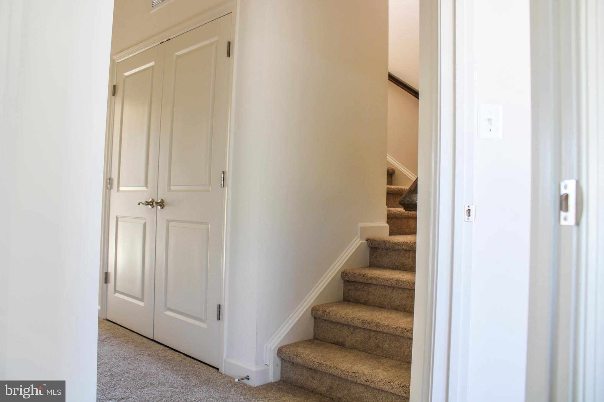 9914 Wood Edge Way Lanham, MD 20706 - Photo 58 of 67 a view of a hallway with stairs