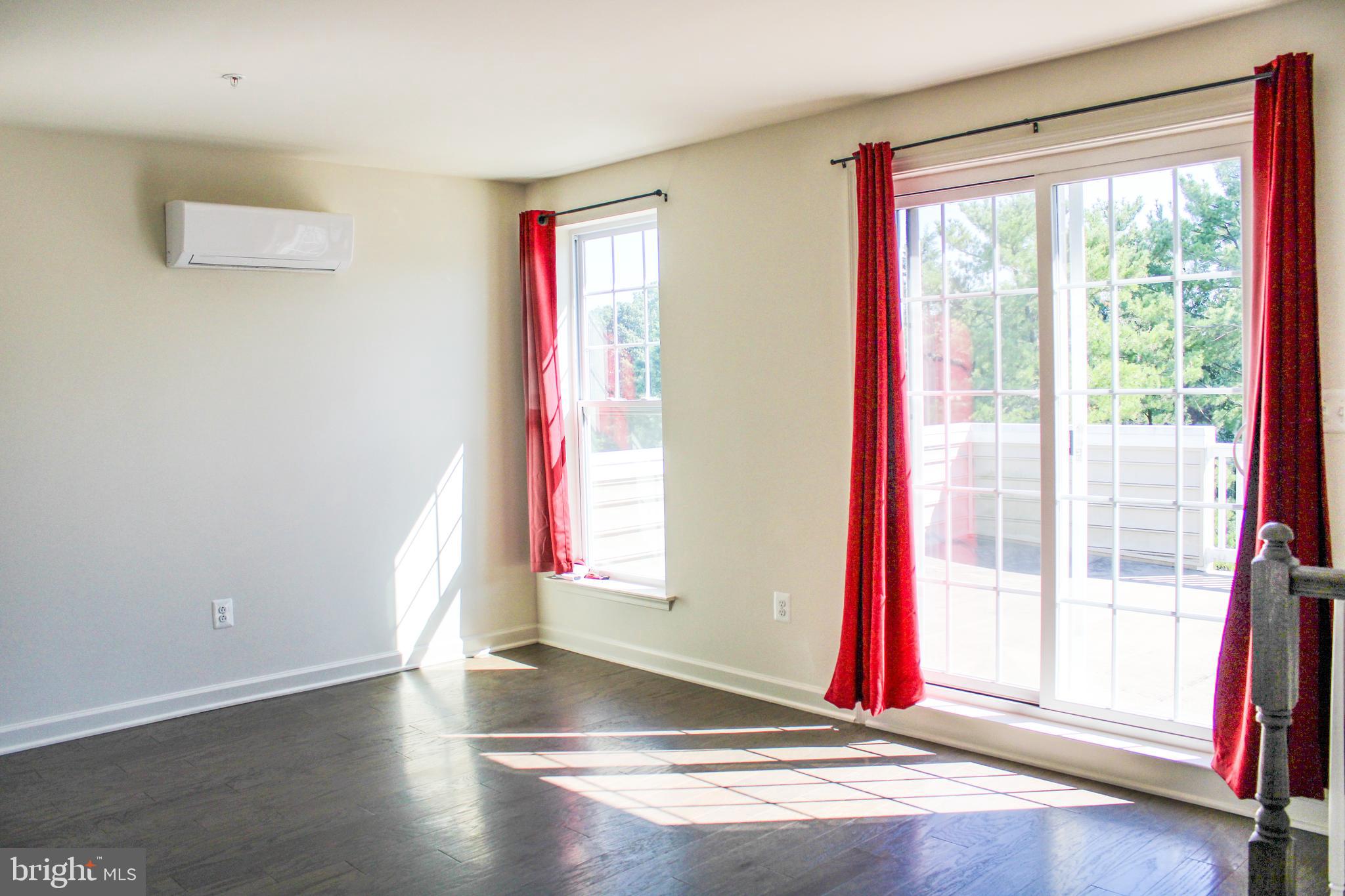 9914 Wood Edge Way Lanham, MD 20706 - Photo 63 of 67 a view of empty room with wooden floor and fan
