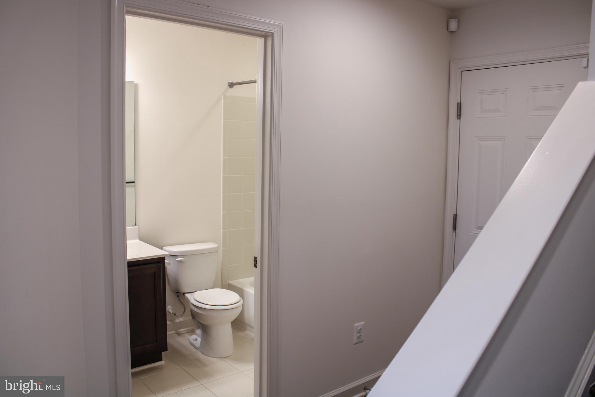 9914 Wood Edge Way Lanham, MD 20706 - Photo 9 of 67 a bathroom with a toilet