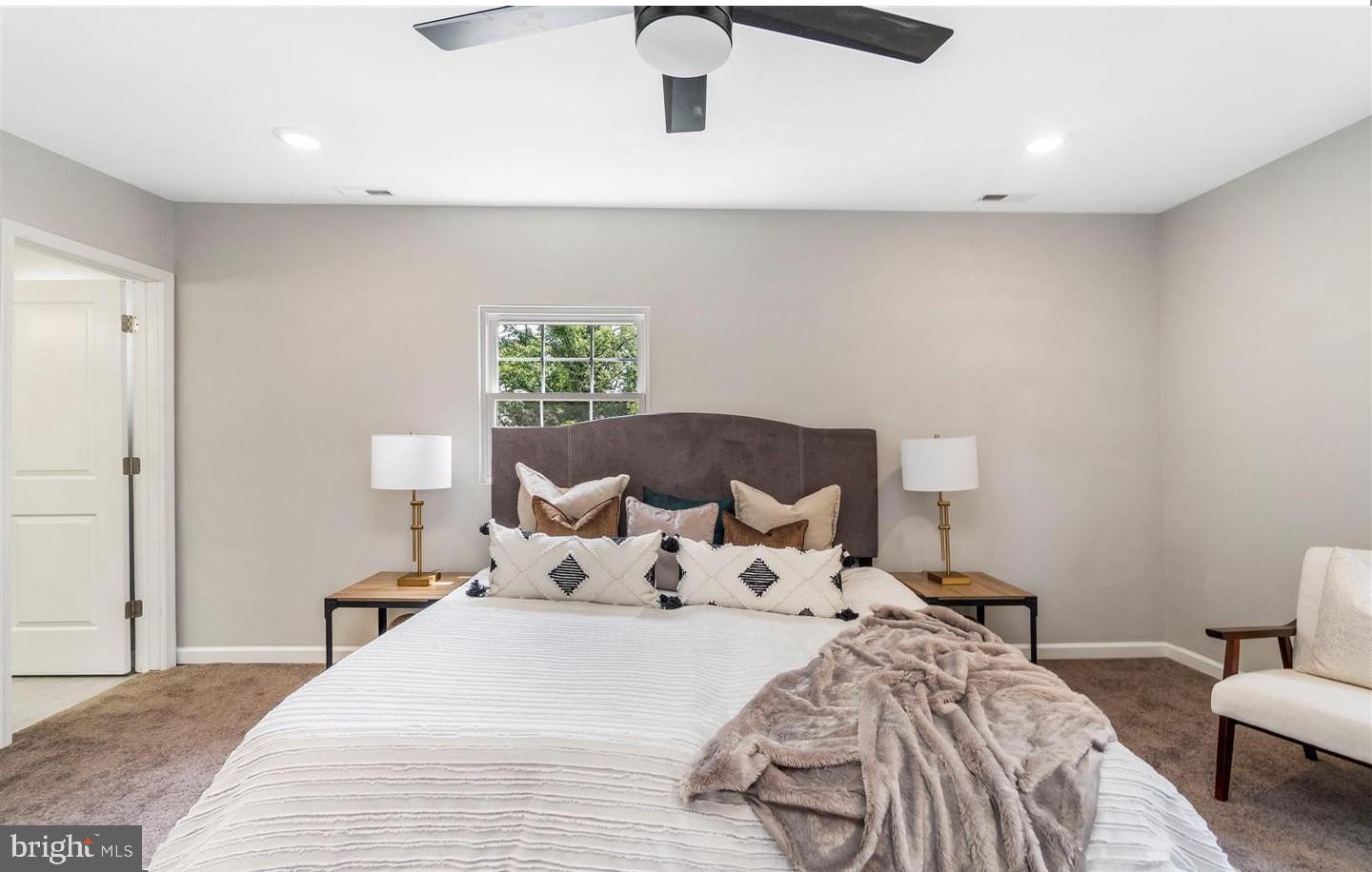 3400 Dennlyn Road Baltimore, MD 21215 - Photo 7 of 32 Serene bedroom with modern elegance.