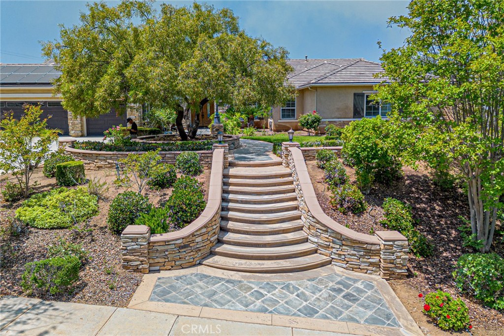 4088 Shady Ridge Circle Corona, CA 92881 - Photo 2 of 47 a front view of a house with a yard