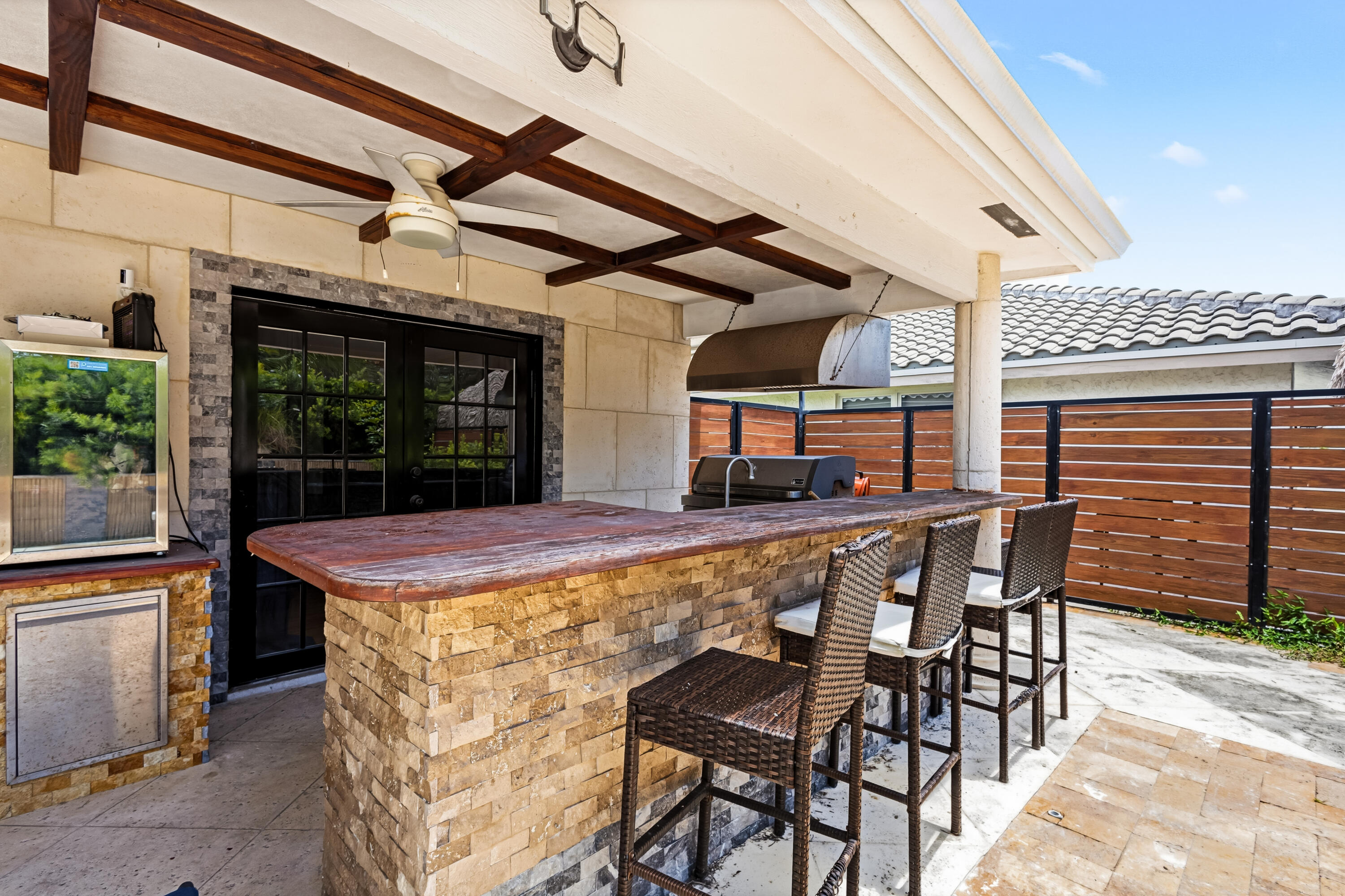 5223 Deerhurst Crescent Circle Boca Raton, FL 33486 - Photo 51 of 51 a view of a patio with a table and chairs