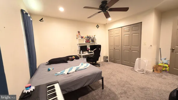 a bedroom with a bed and furniture