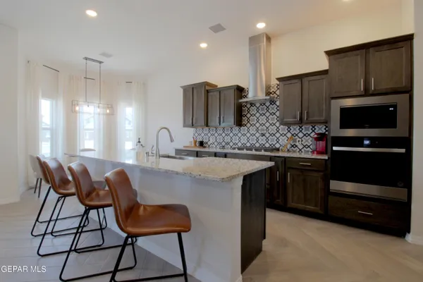 a living room with furniture and a piano