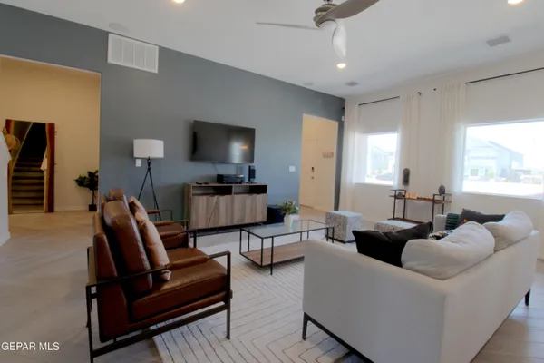 a bathroom with a granite countertop sink a toilet and shower