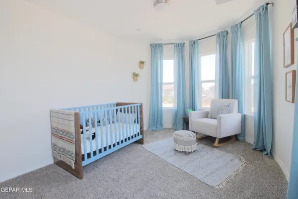 a bedroom with a bed and a table