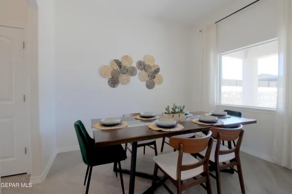 a view of a dining room with furniture and window