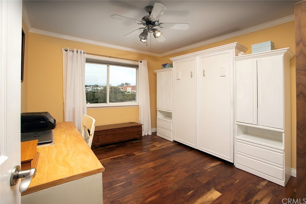 23965 Leeward Drive Dana Point, CA 92629 - Photo 13 of 27 a bedroom with wooden floor and a bed