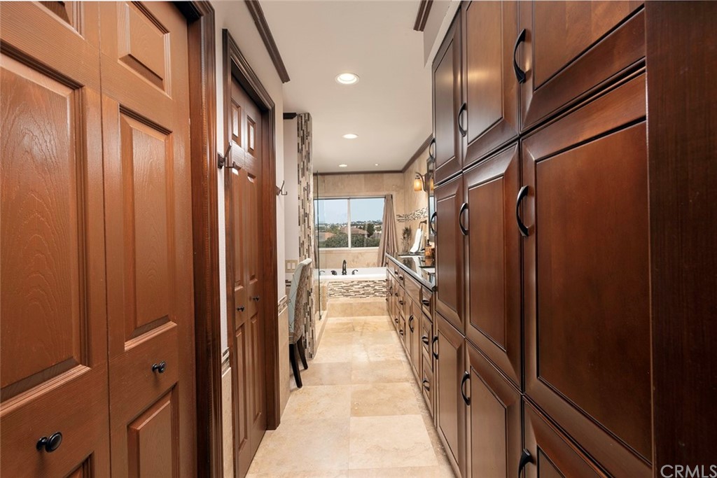 23965 Leeward Drive Dana Point, CA 92629 - Photo 15 of 27 a view of a hallway with wooden floor and staircase