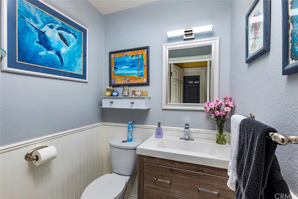 23965 Leeward Drive Dana Point, CA 92629 - Photo 18 of 27 a bathroom with a sink mirror vanity and toilet