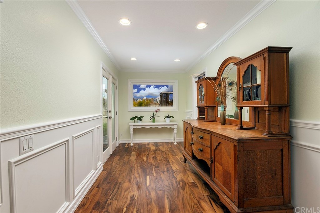 23965 Leeward Drive Dana Point, CA 92629 - Photo 10 of 27 a large kitchen with stainless steel appliances a large counter top a stove and a wooden floors