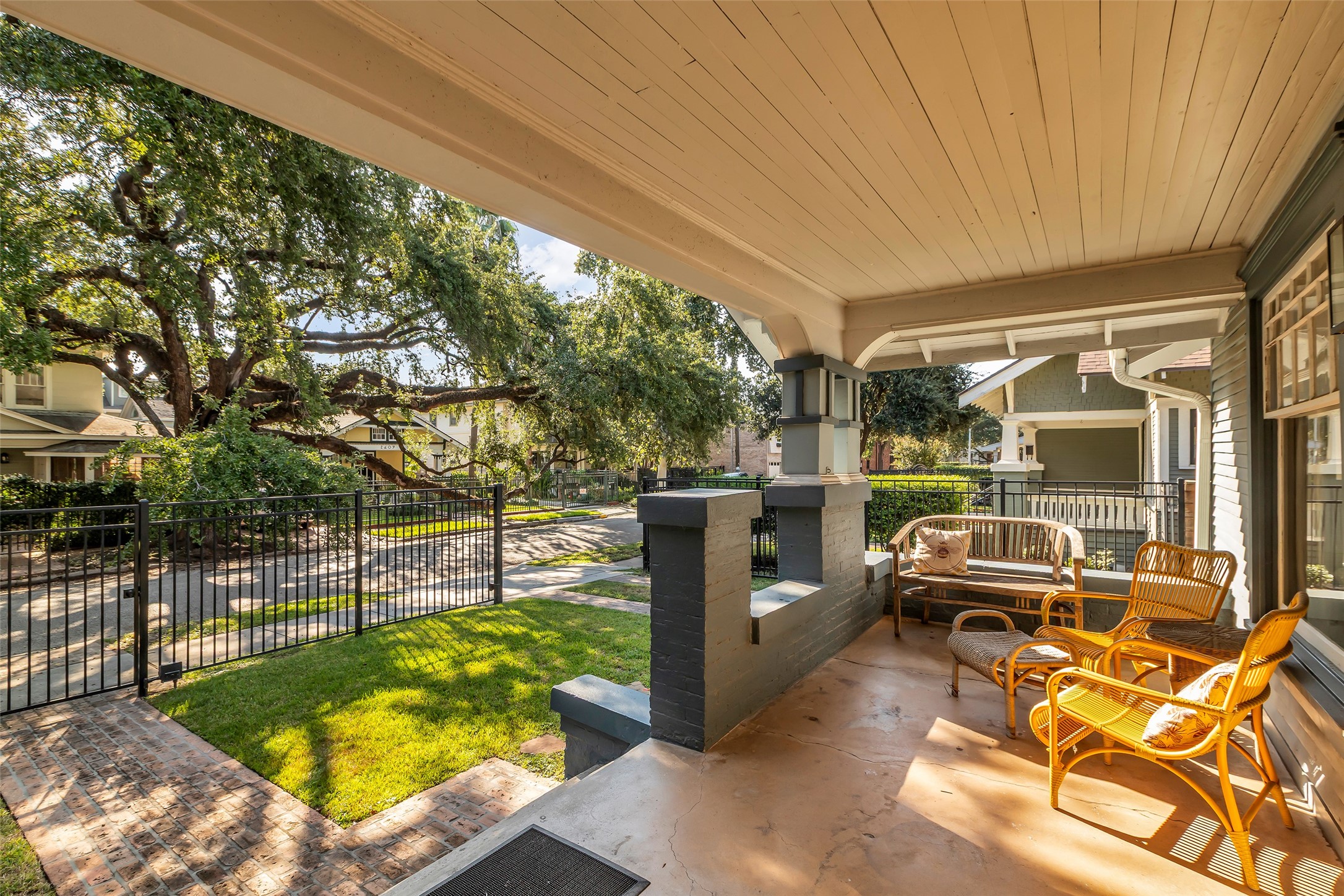 2606 Hopkins Street Houston, TX 77006 - Photo 4 of 30 View of the magnificent towering oak trees from the front porch.