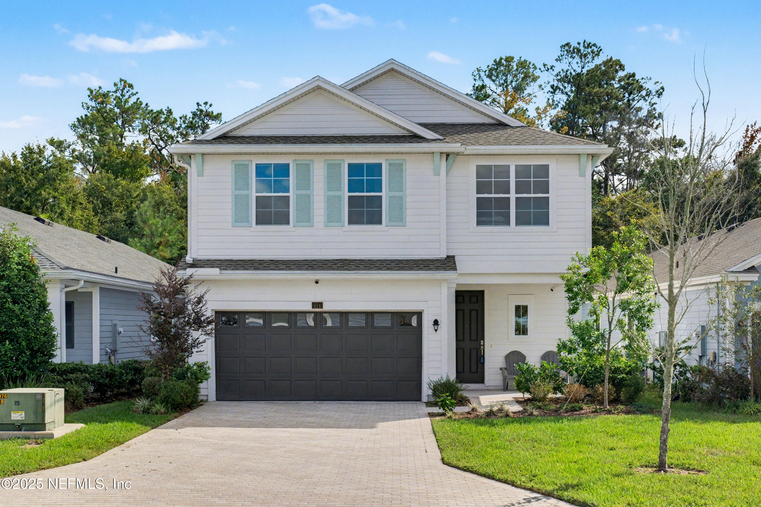 111 Windswept Way St. Augustine, FL 32092 - Photo 1 of 63 a front view of a house with a yard and garage