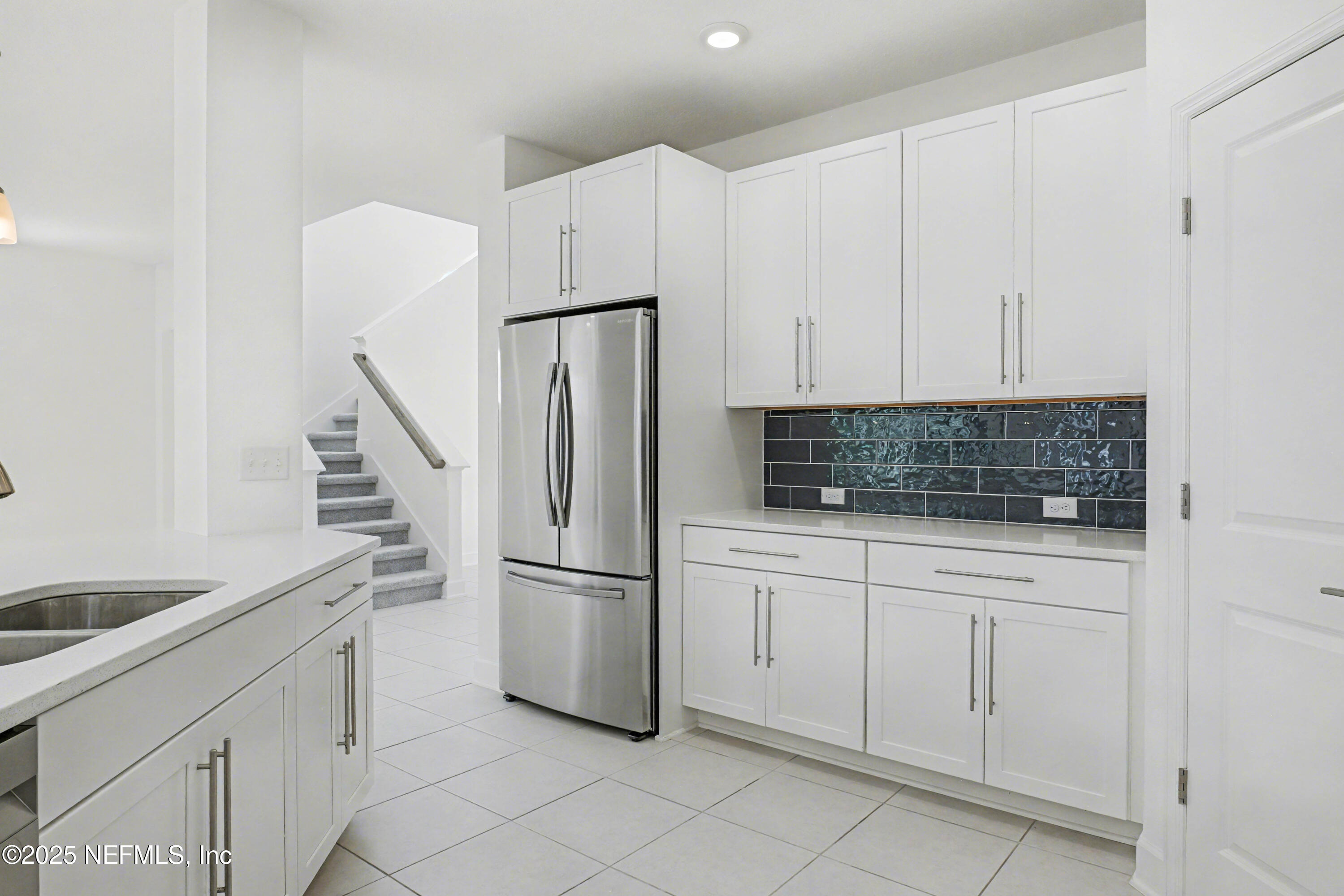 111 Windswept Way St. Augustine, FL 32092 - Photo 14 of 63 a kitchen with appliances a sink and cabinets