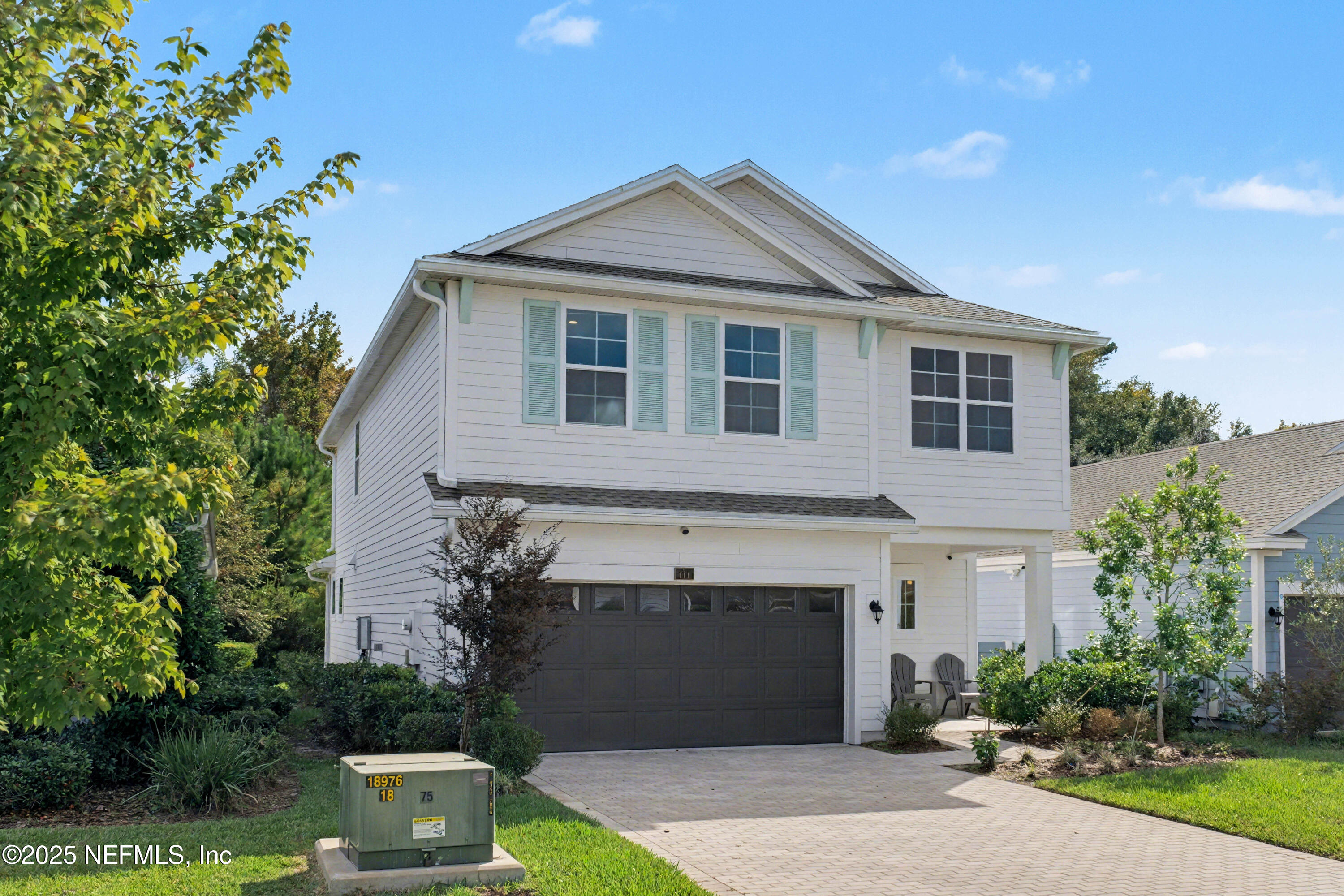 111 Windswept Way St. Augustine, FL 32092 - Photo 2 of 63 a front view of a house with garden