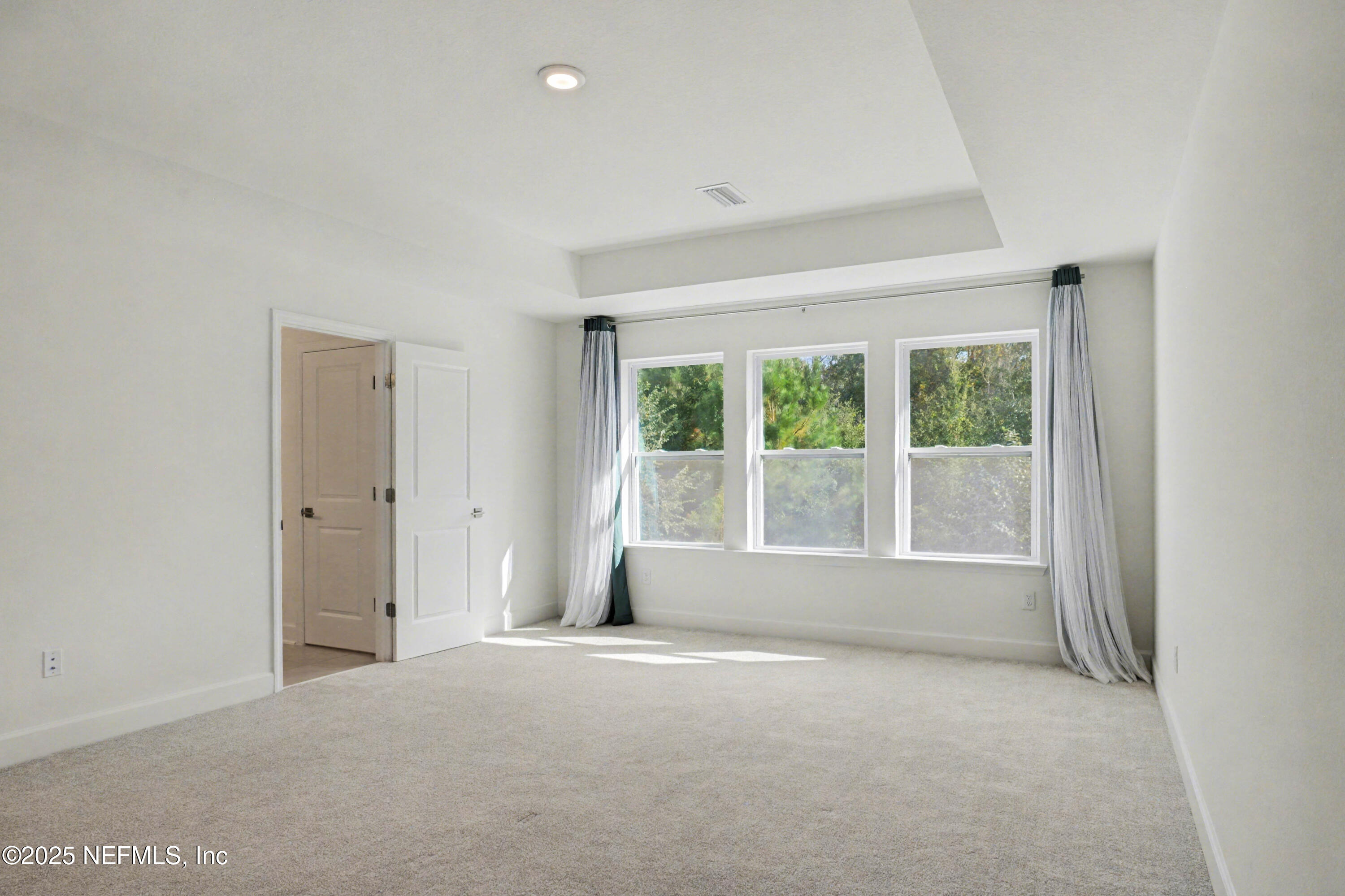 111 Windswept Way St. Augustine, FL 32092 - Photo 23 of 63 a view of an empty room with a window