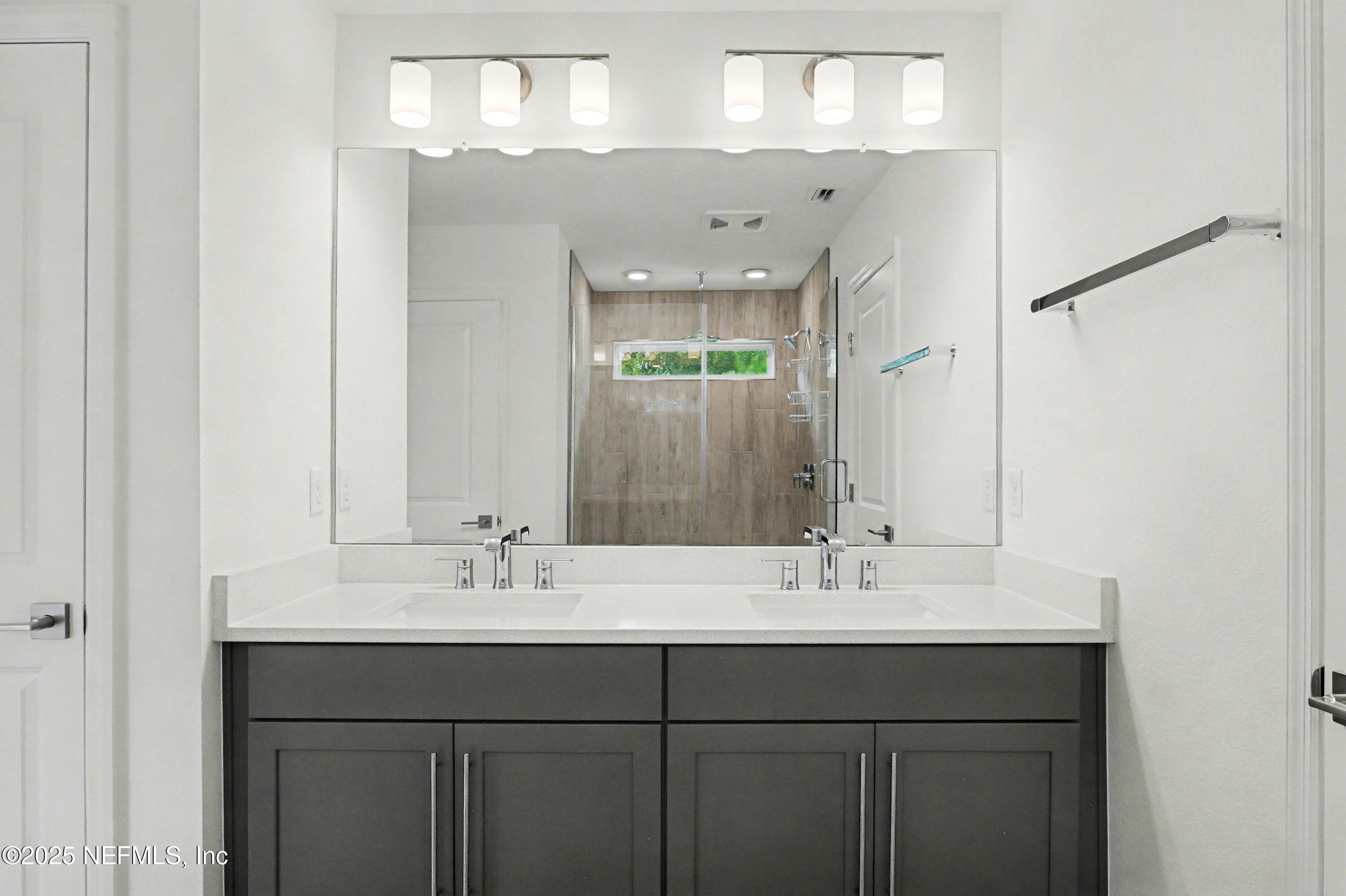111 Windswept Way St. Augustine, FL 32092 - Photo 27 of 63 a bathroom with a sink double vanity and a mirror
