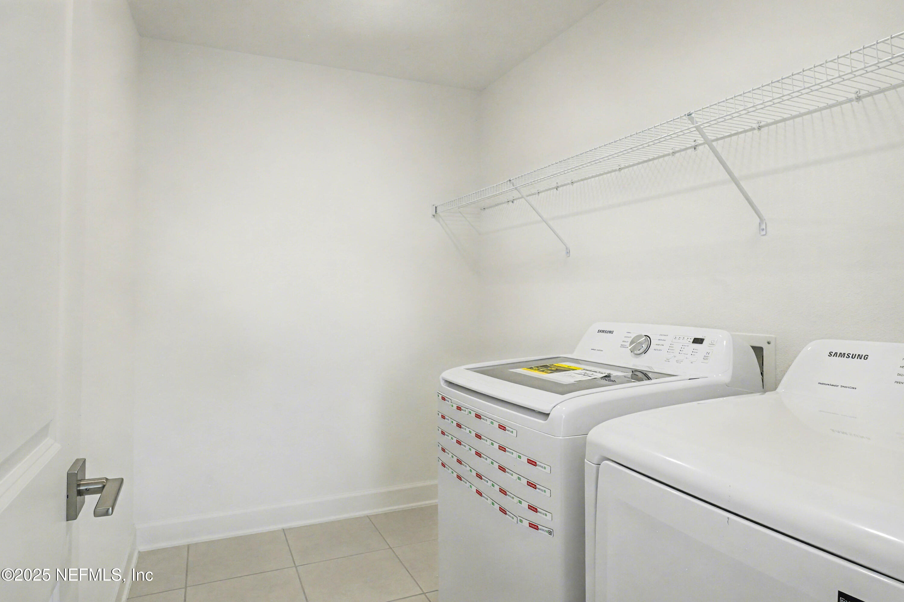 111 Windswept Way St. Augustine, FL 32092 - Photo 39 of 63 a utility room with dryer and washer