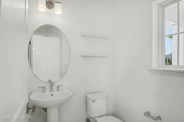 an aerial view of residential house with outdoor space and parking