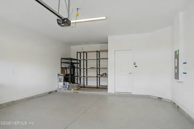 an aerial view of a house with a swimming pool