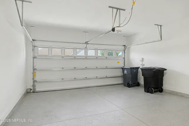 an aerial view of a house with swimming pool patio and outdoor seating
