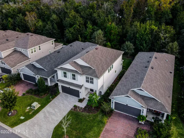 an aerial view of a house with a garden