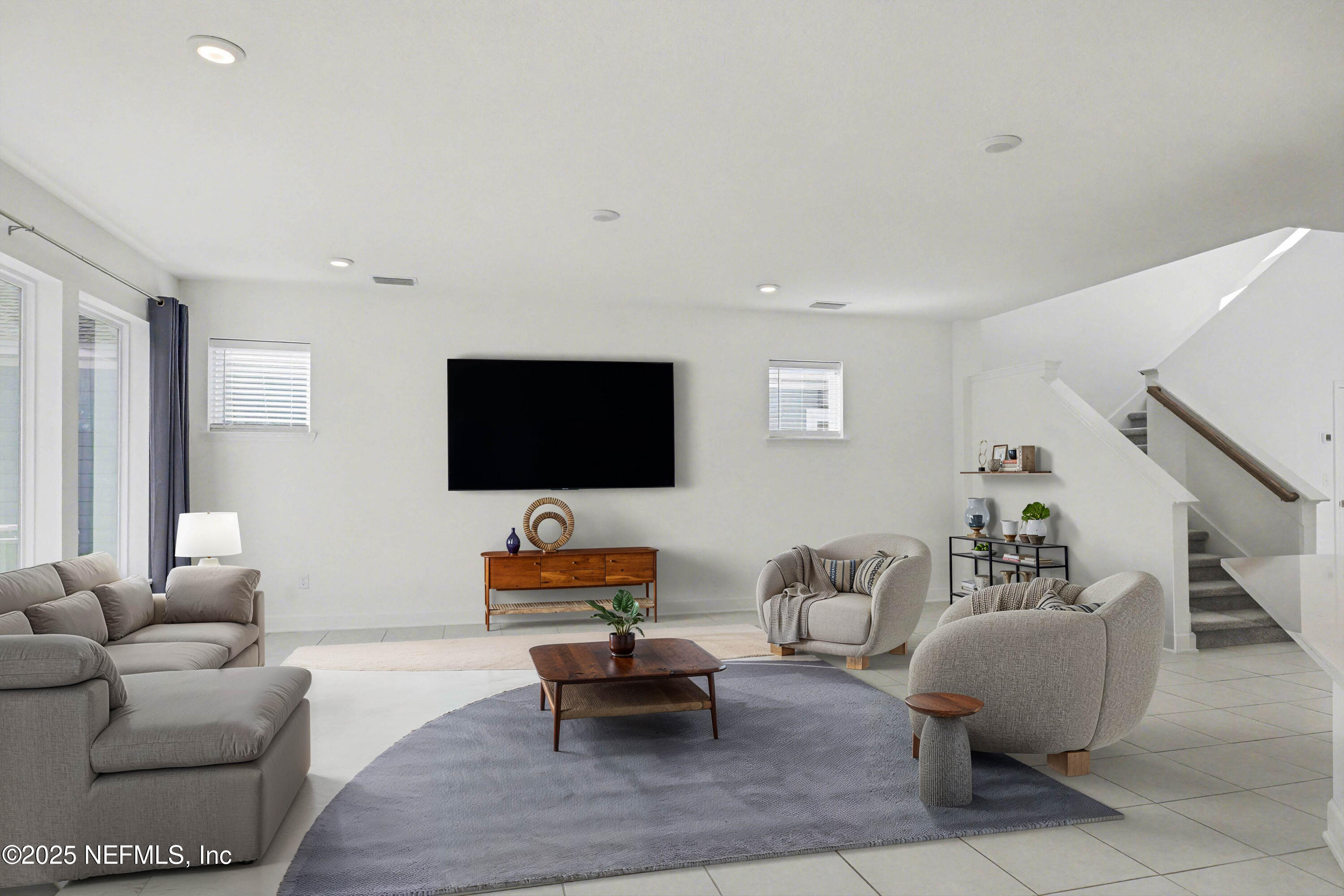 111 Windswept Way St. Augustine, FL 32092 - Photo 10 of 63 a living room with furniture and a flat screen tv