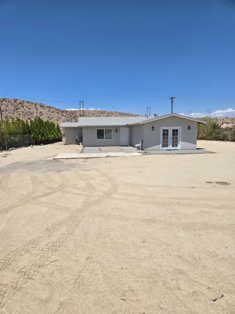 a house view with a backyard space
