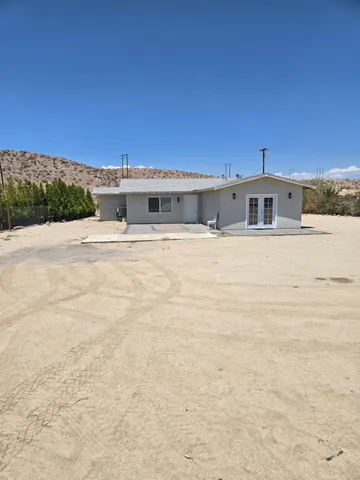 a house view with a backyard space