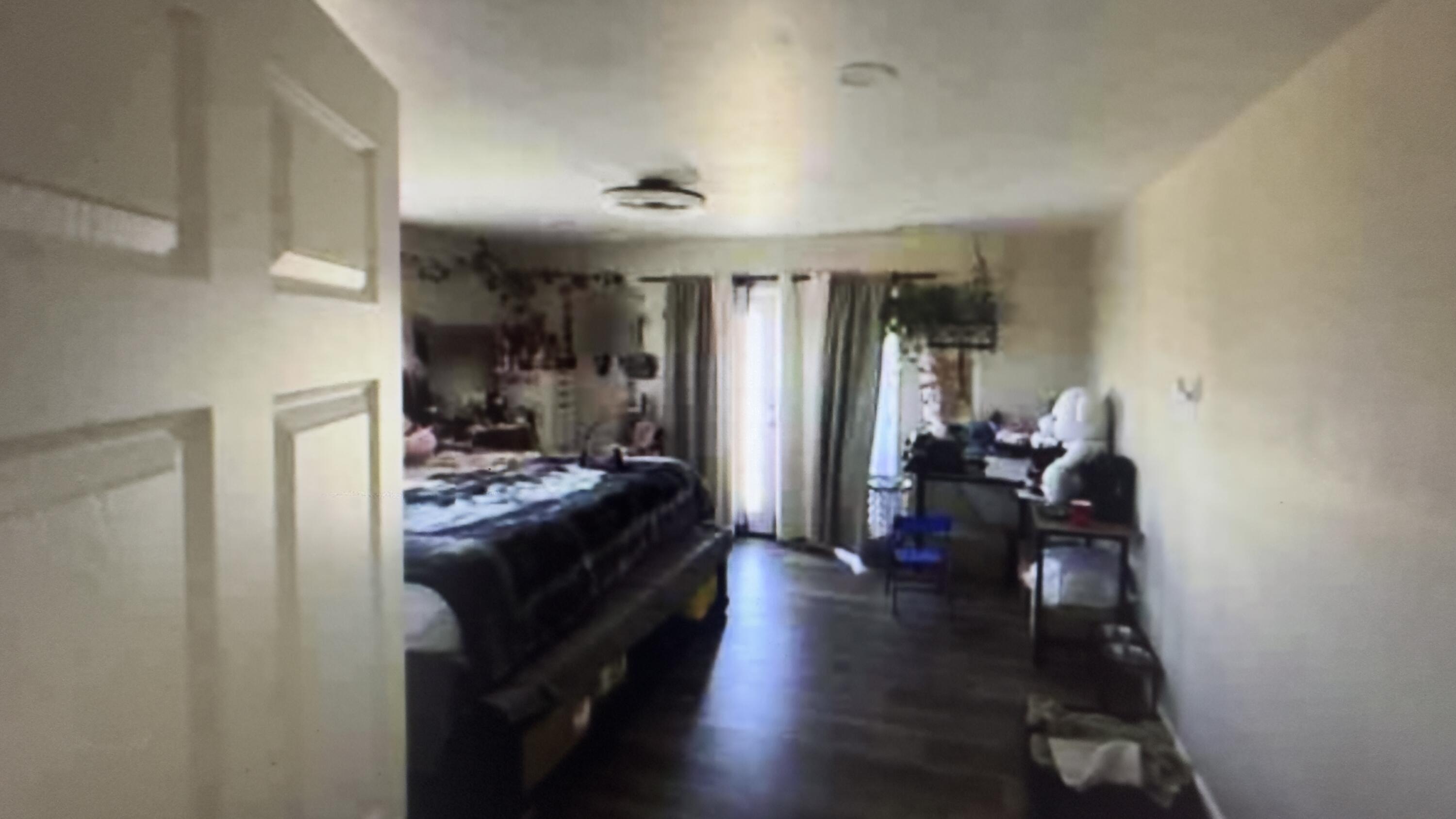 Undisclosed Address Desert Hot Springs, CA 92241 - Photo 11 of 29 a view of a hallway with livingroom and furniture