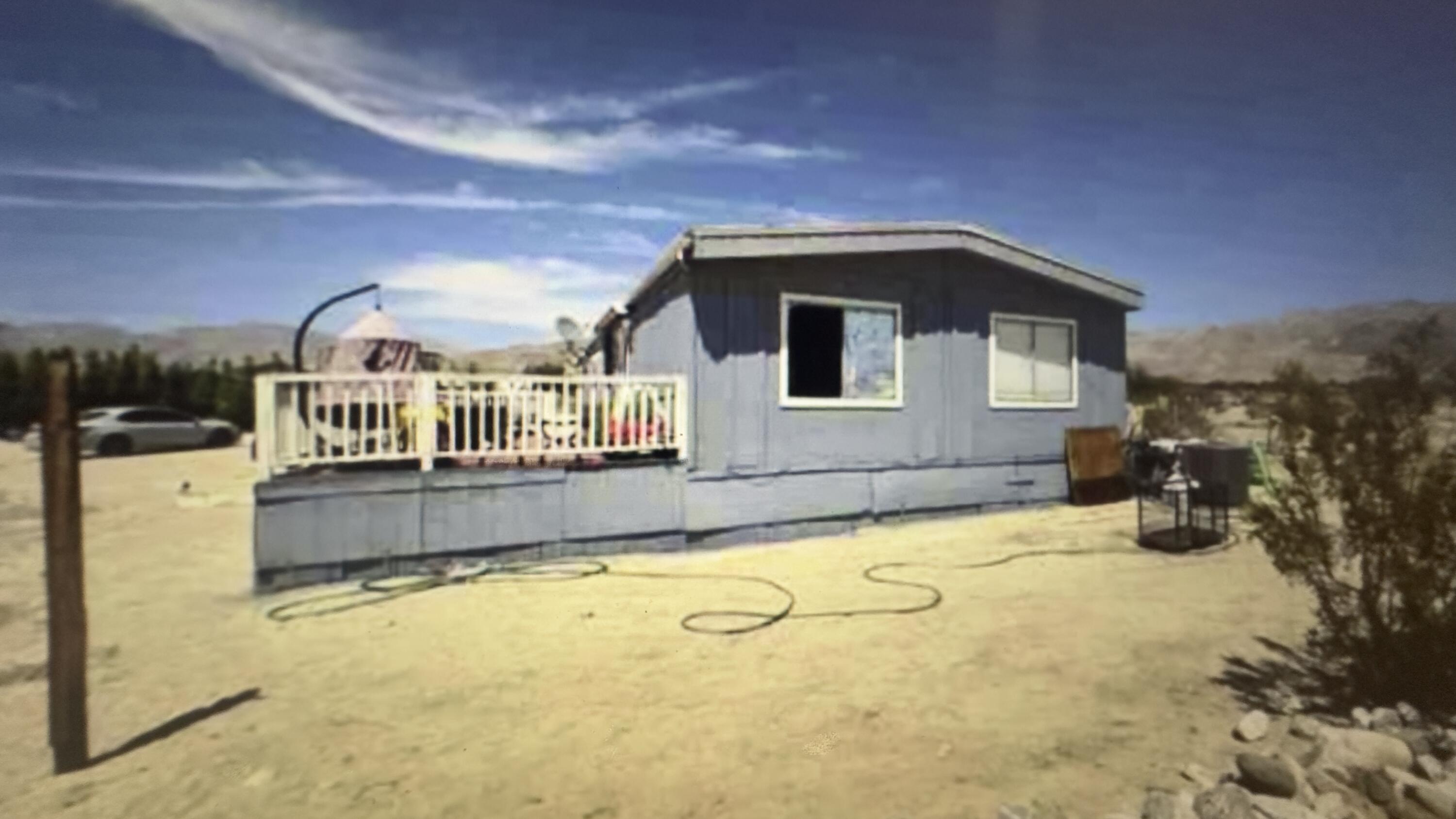 Undisclosed Address Desert Hot Springs, CA 92241 - Photo 16 of 29 a house with swimming pool in front of it