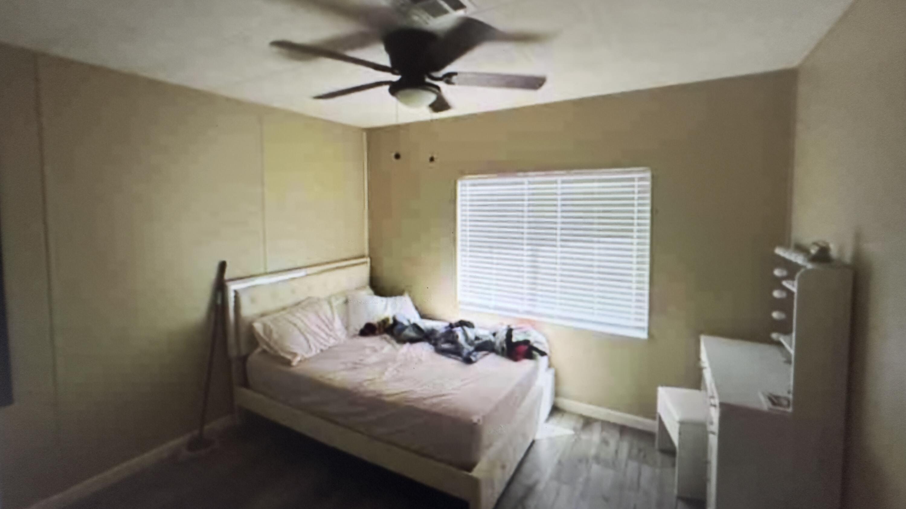 Undisclosed Address Desert Hot Springs, CA 92241 - Photo 21 of 29 a bedroom with a bed and a window