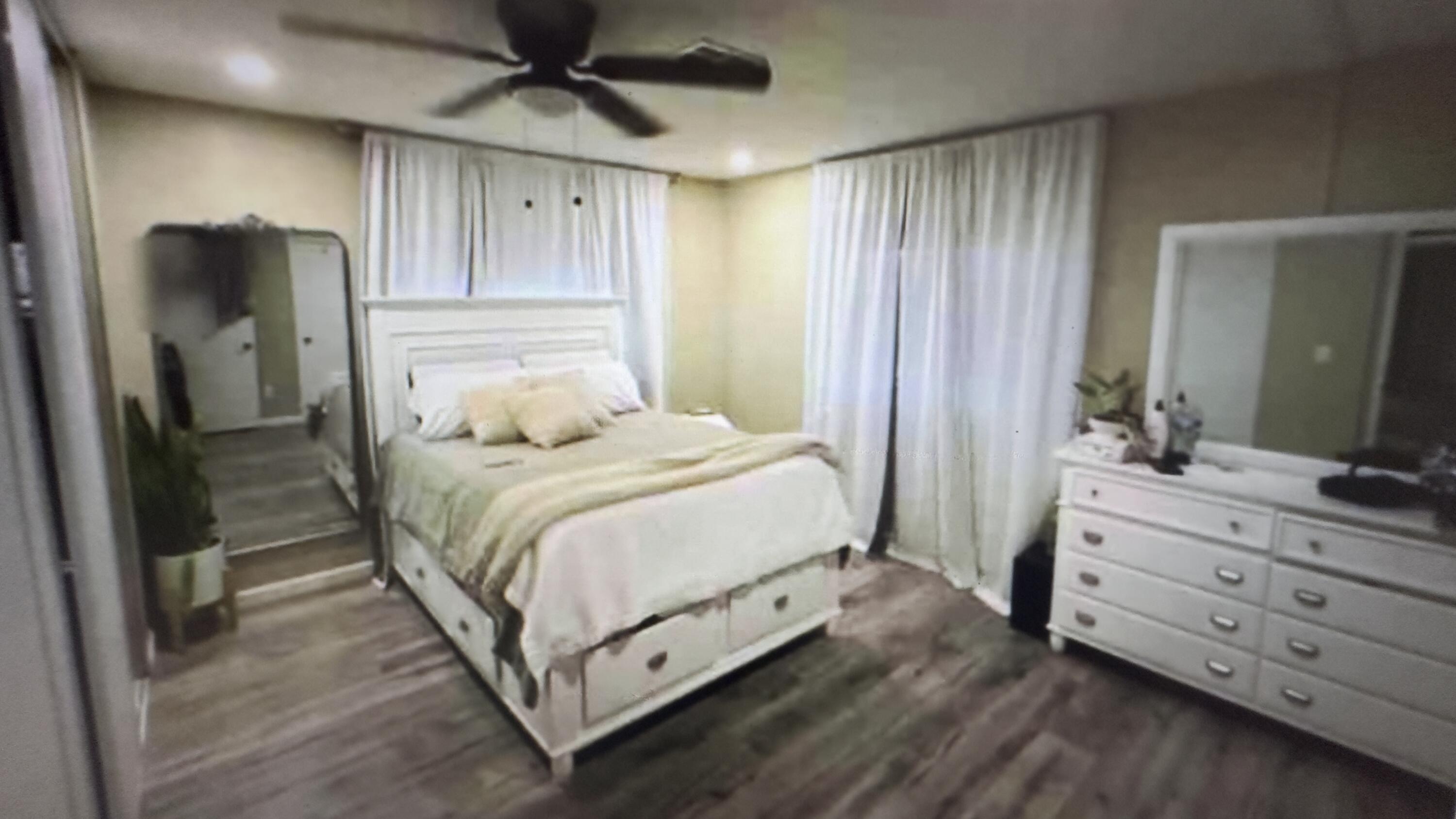 Undisclosed Address Desert Hot Springs, CA 92241 - Photo 25 of 29 a bedroom with a bed and a dresser