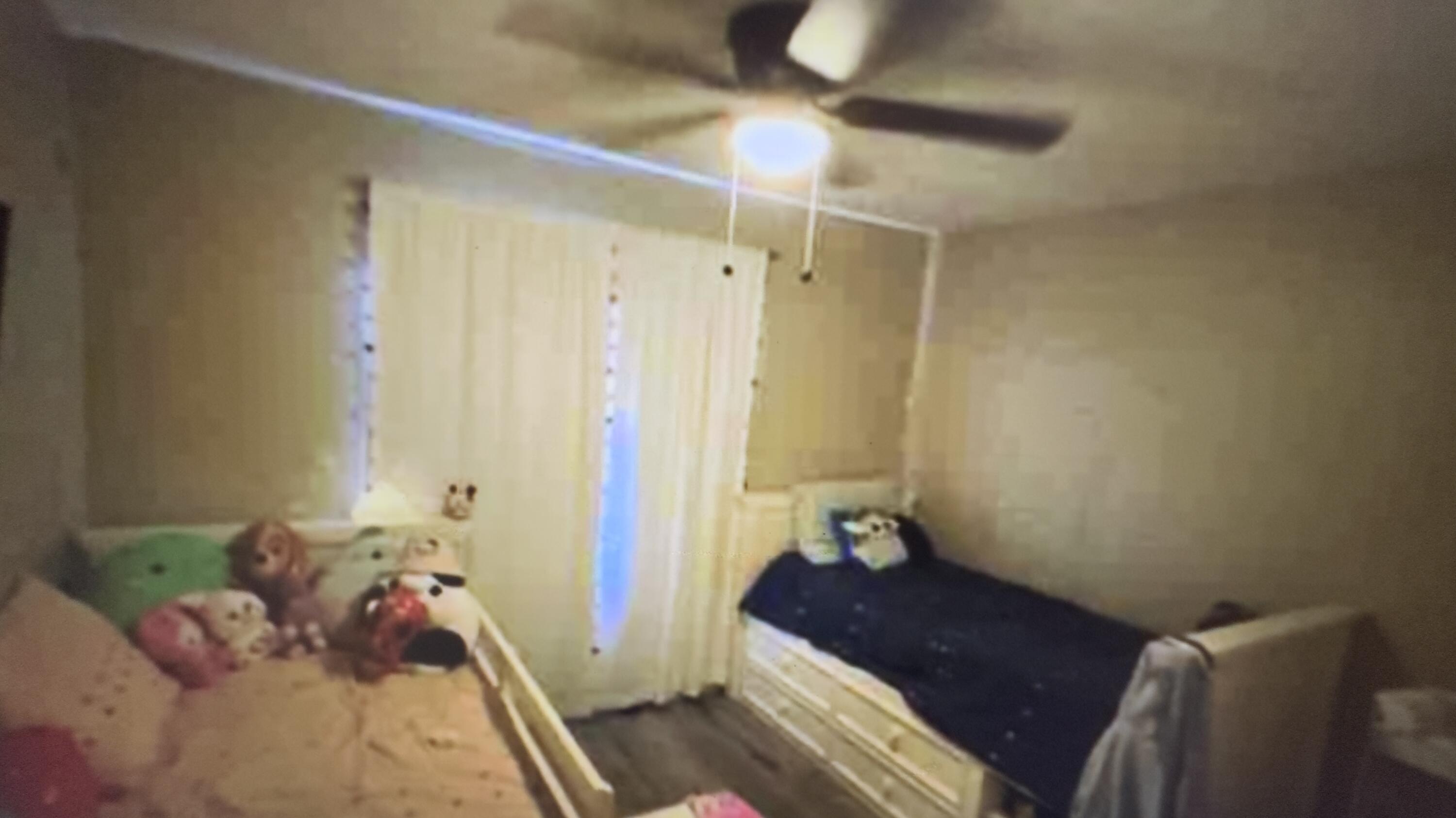 Undisclosed Address Desert Hot Springs, CA 92241 - Photo 27 of 29 a bedroom with a bed and a chandelier