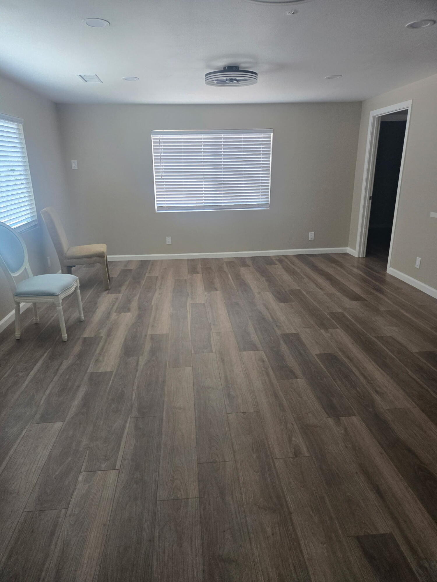 Undisclosed Address Desert Hot Springs, CA 92241 - Photo 7 of 29 an empty room with wooden floor and windows