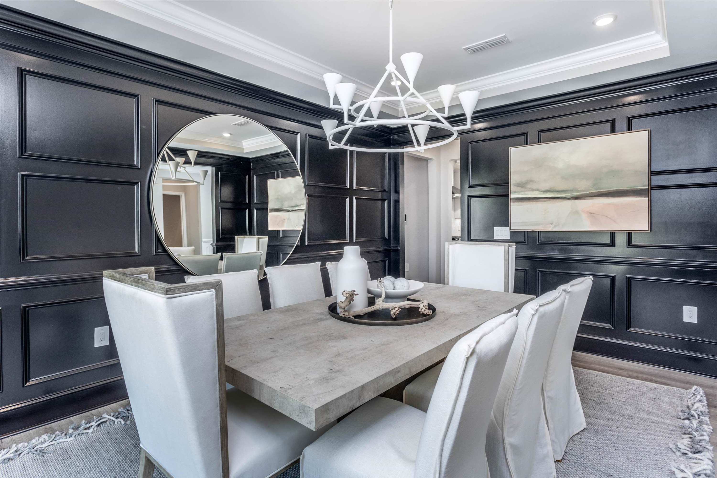 300 Heritage Regency Drive Wake Forest, NC 27587 - Photo 13 of 31 a dining room with furniture a chandelier and wooden floor