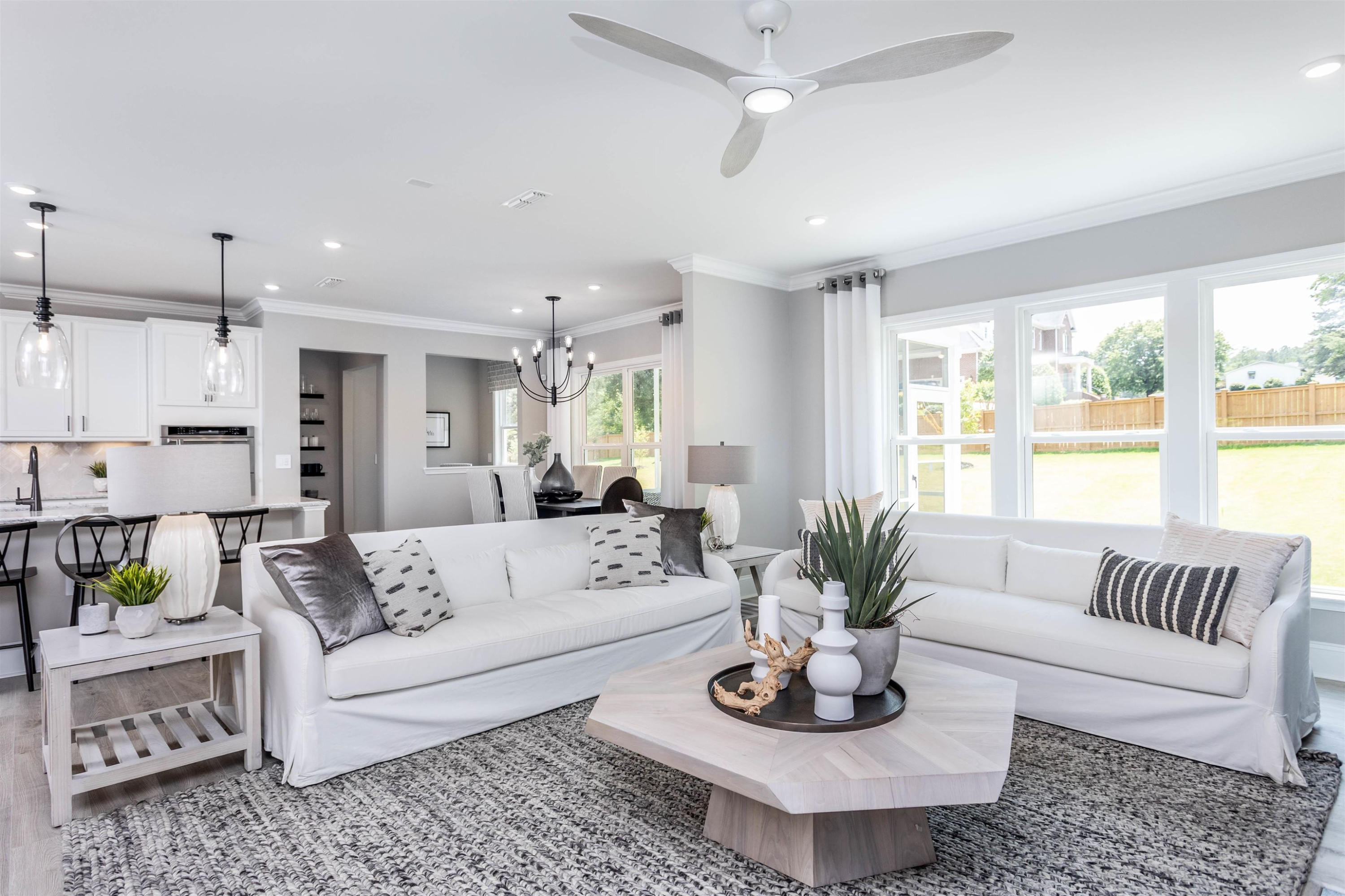 300 Heritage Regency Drive Wake Forest, NC 27587 - Photo 15 of 31 a living room with furniture potted plant and a window