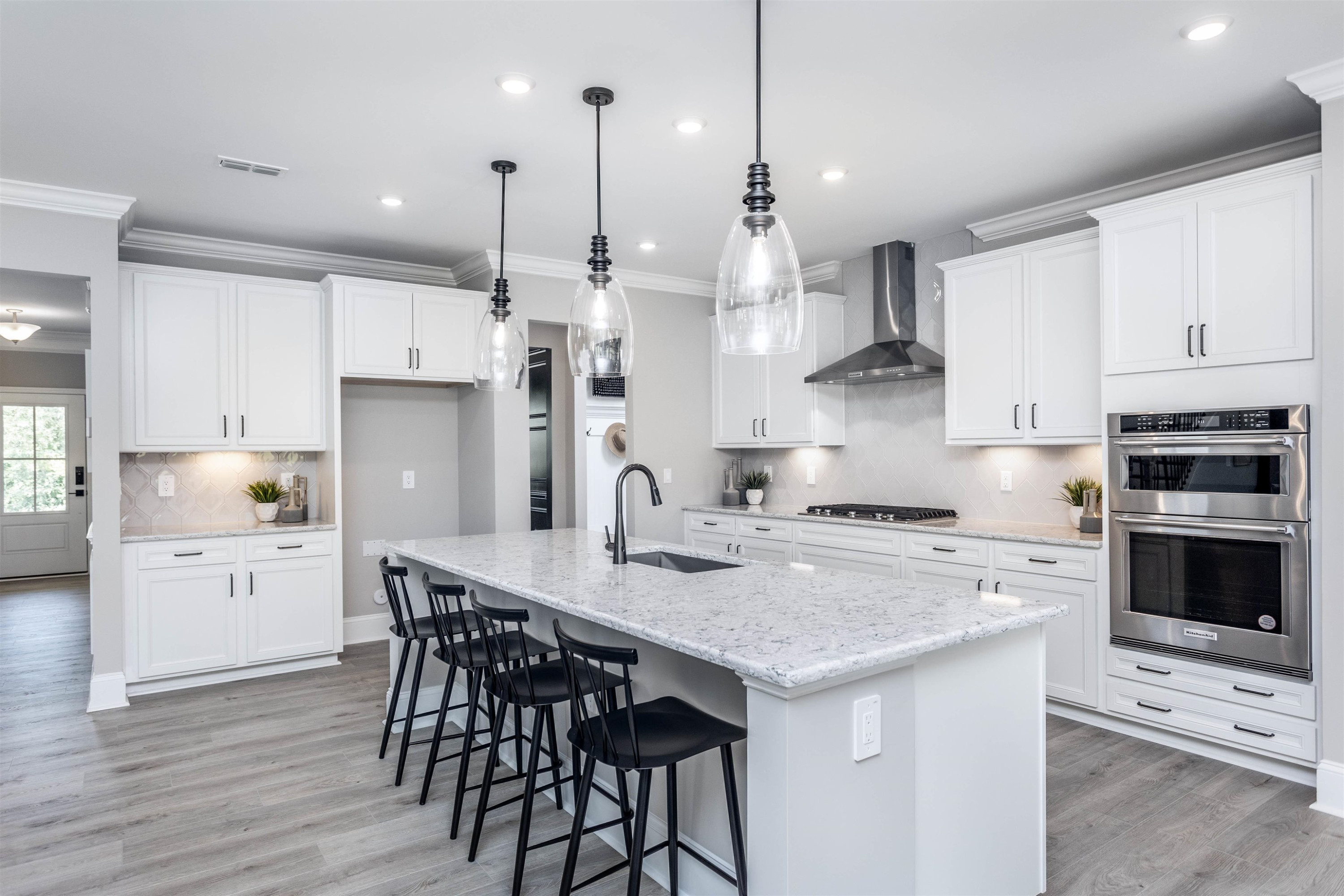 300 Heritage Regency Drive Wake Forest, NC 27587 - Photo 16 of 31 a kitchen with stainless steel appliances a stove a sink a stove a center island and a refrigerator