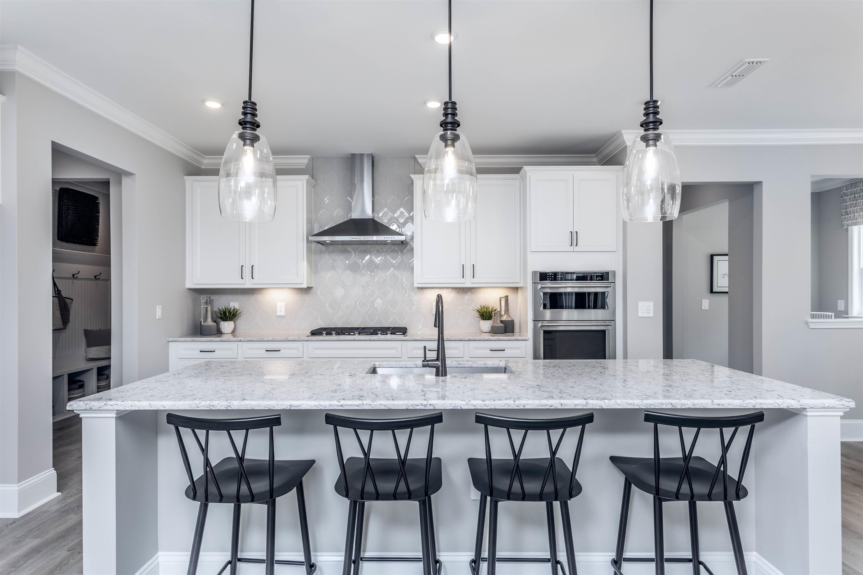 300 Heritage Regency Drive Wake Forest, NC 27587 - Photo 18 of 31 a kitchen with kitchen island a dining table and chairs