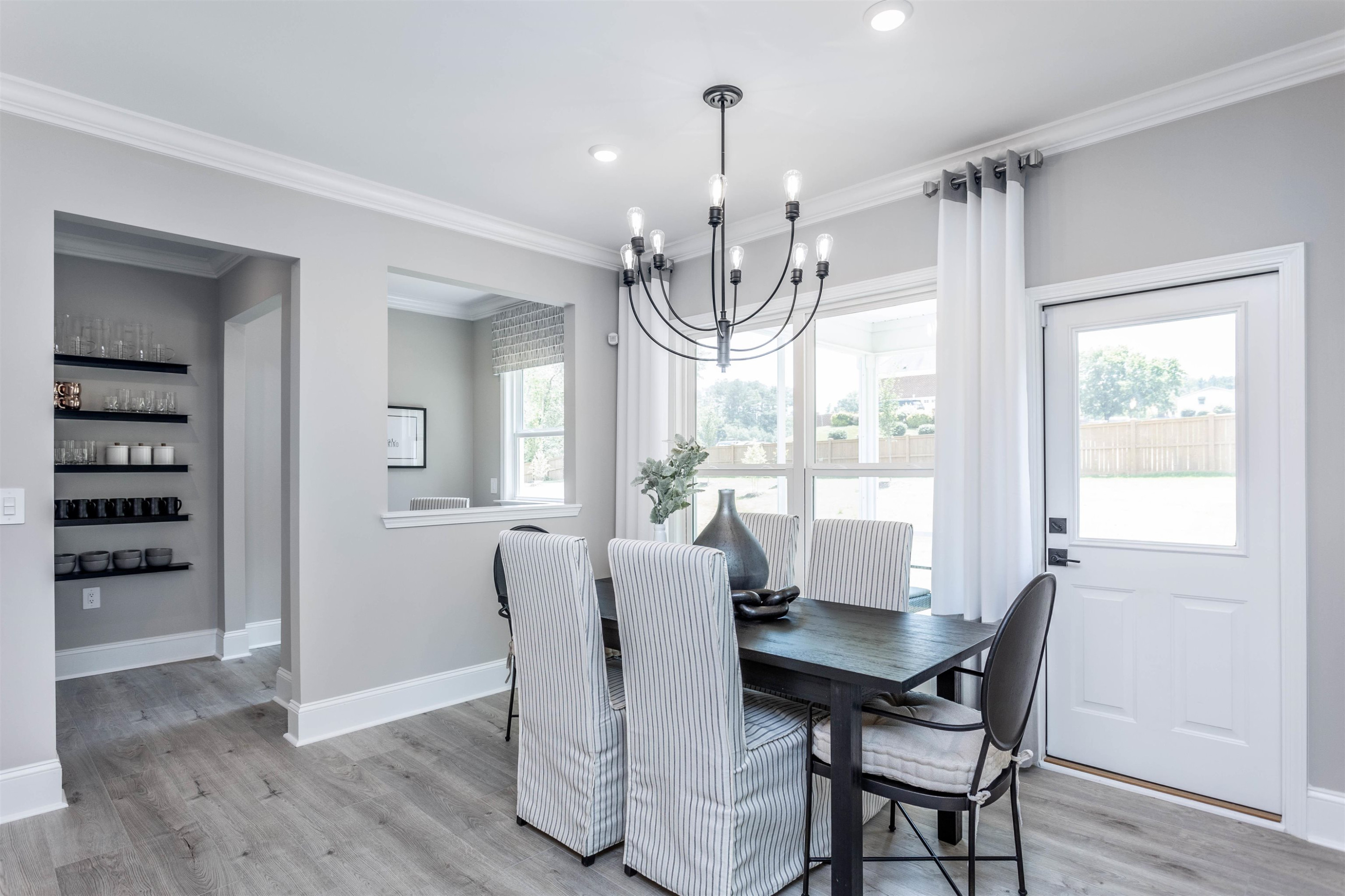 300 Heritage Regency Drive Wake Forest, NC 27587 - Photo 19 of 31 a view of a dining room with furniture wooden floor and chandelier
