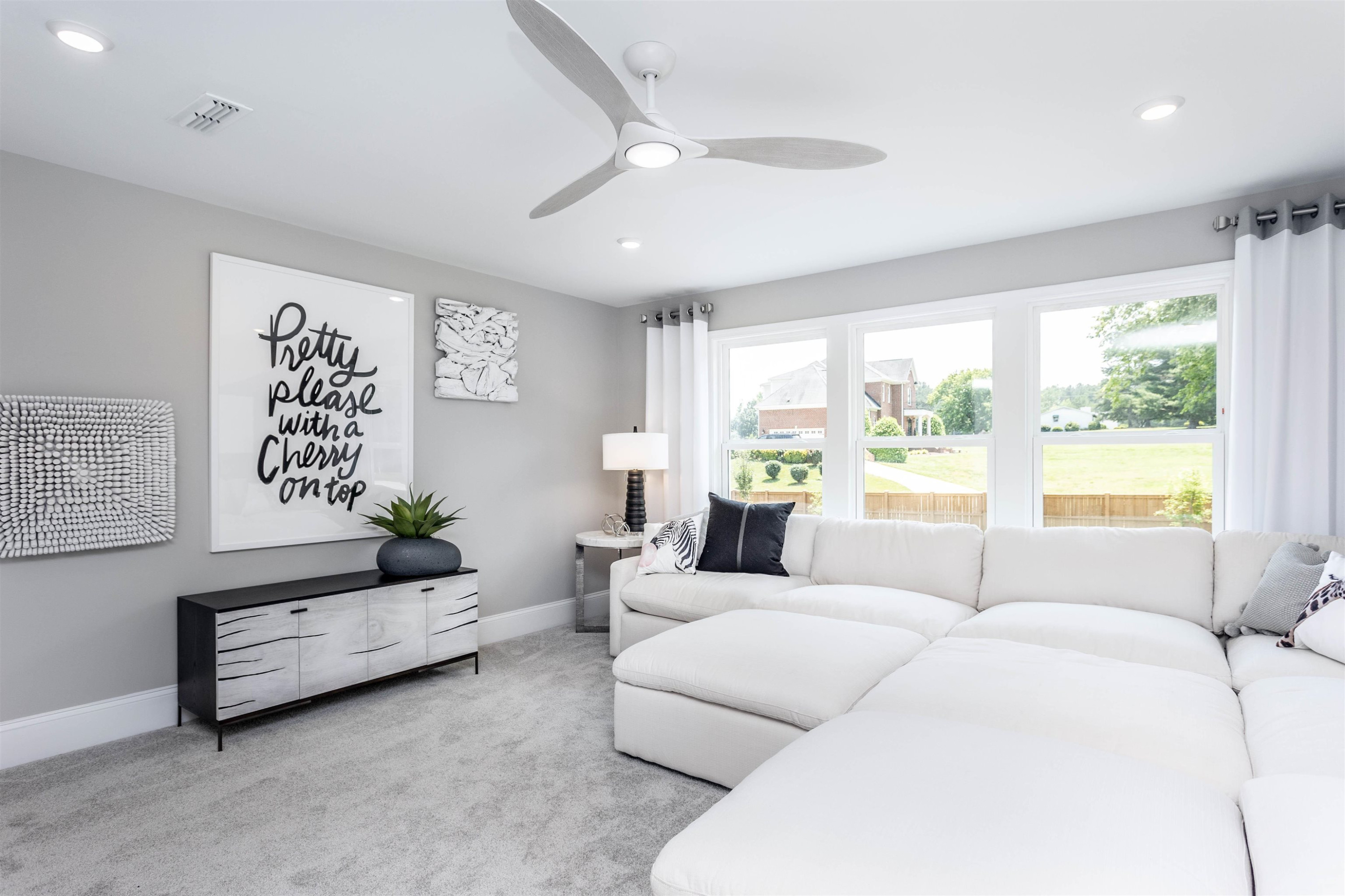 300 Heritage Regency Drive Wake Forest, NC 27587 - Photo 22 of 31 a living room with furniture and a large window