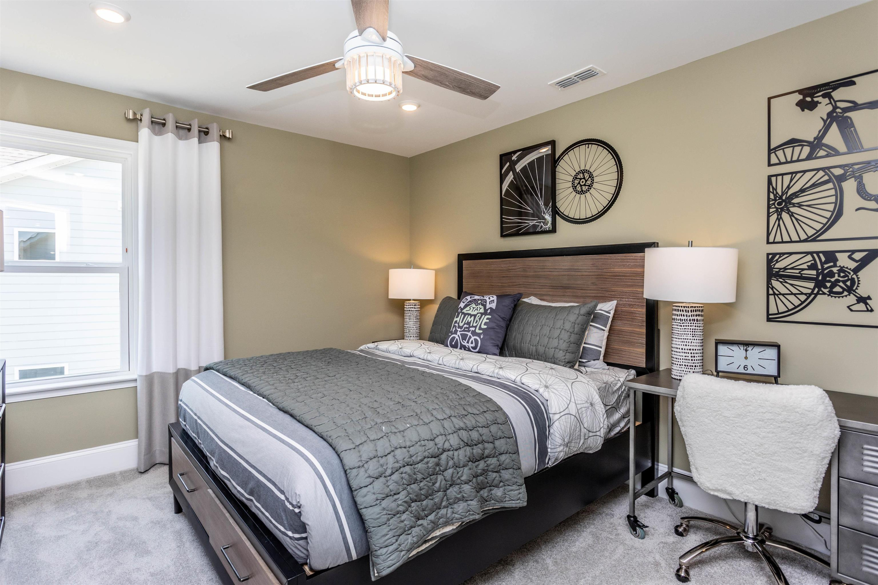 300 Heritage Regency Drive Wake Forest, NC 27587 - Photo 27 of 31 a bedroom with a bed and a lamp on the dresser