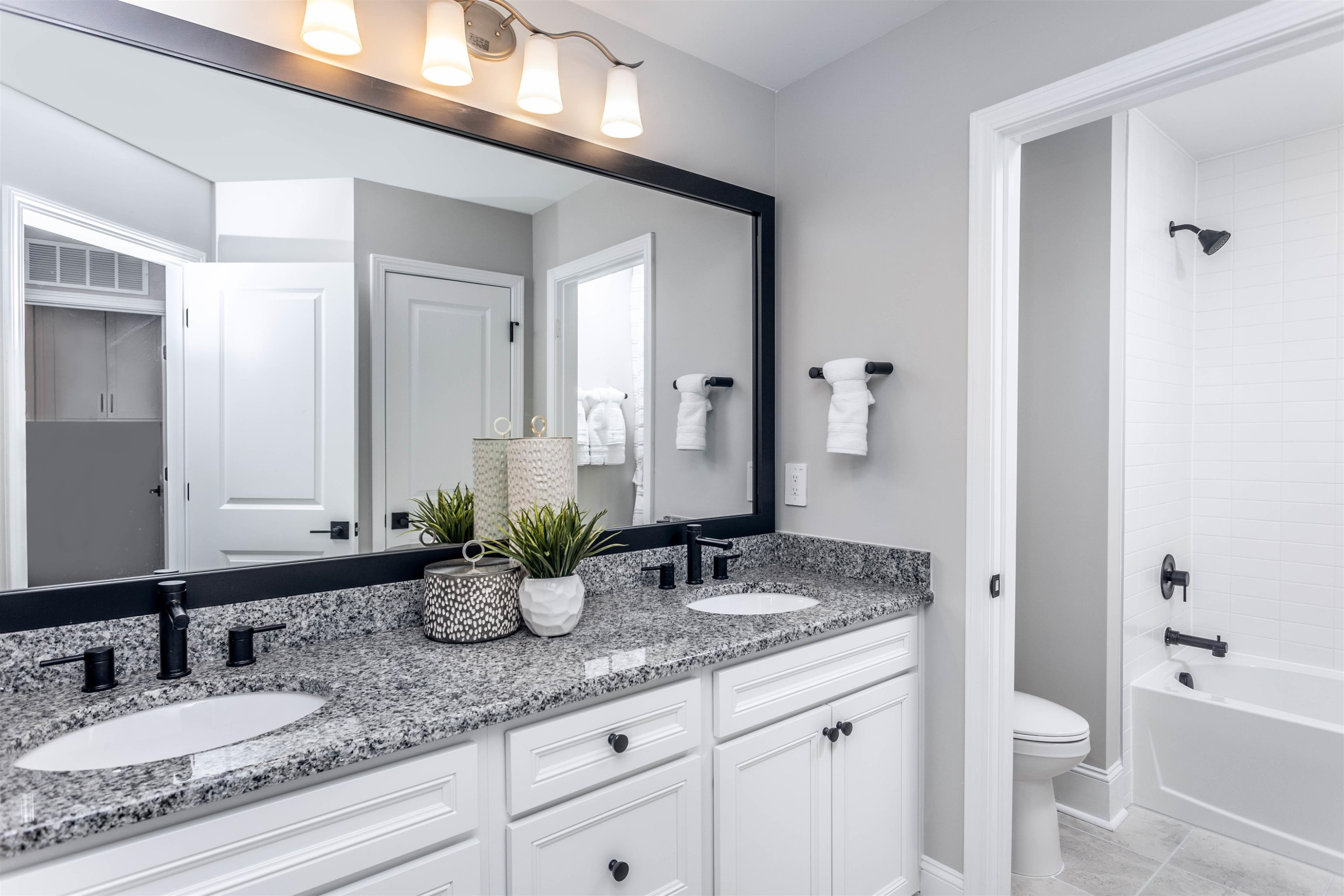 300 Heritage Regency Drive Wake Forest, NC 27587 - Photo 28 of 31 a bathroom with double sink and a mirror
