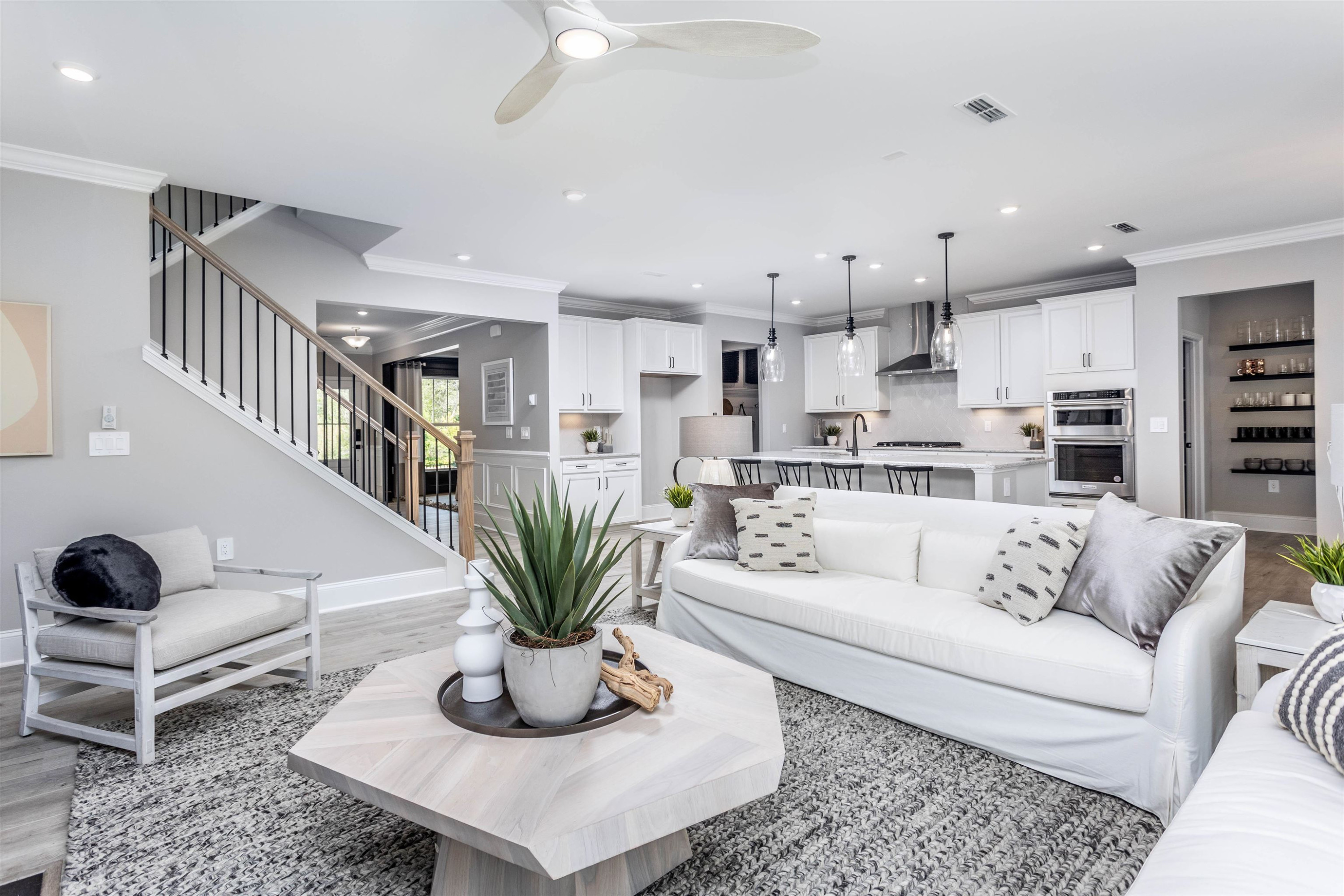 300 Heritage Regency Drive Wake Forest, NC 27587 - Photo 5 of 31 a living room with furniture potted plant and kitchen view