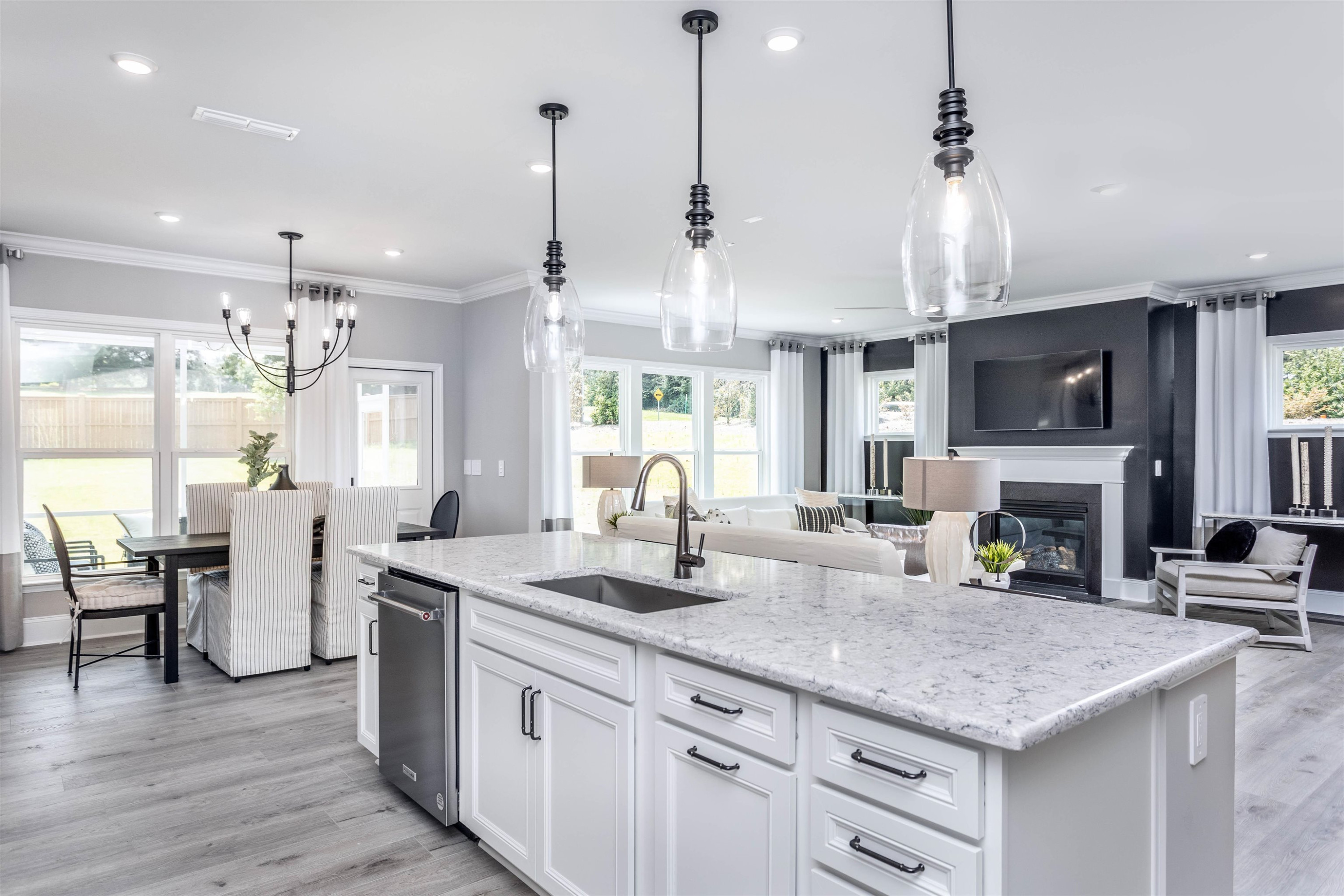 300 Heritage Regency Drive Wake Forest, NC 27587 - Photo 7 of 31 a kitchen with lots of counter space a sink appliances and dining table