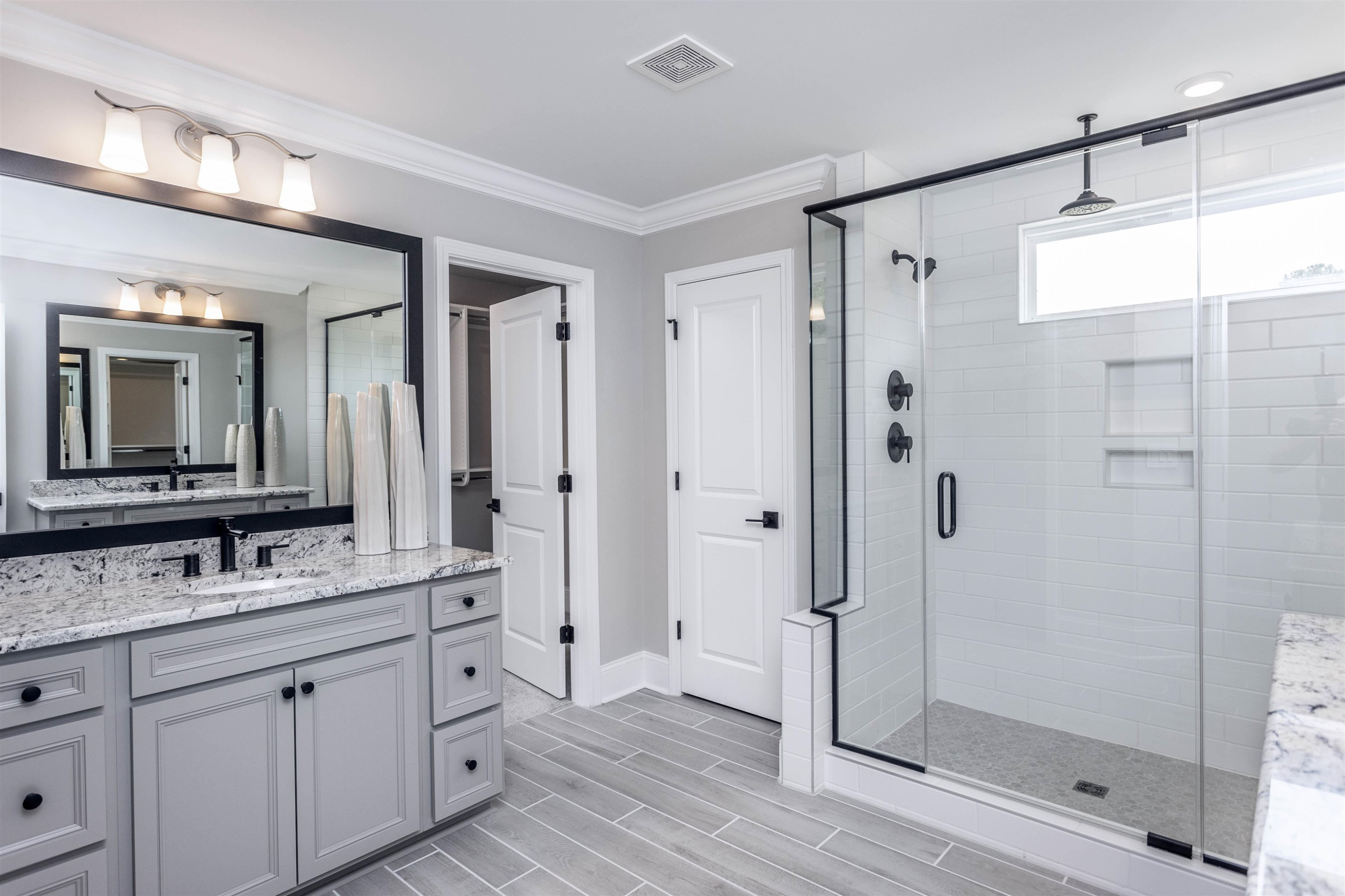 300 Heritage Regency Drive Wake Forest, NC 27587 - Photo 9 of 31 a bathroom with a double vanity sink mirror and shower