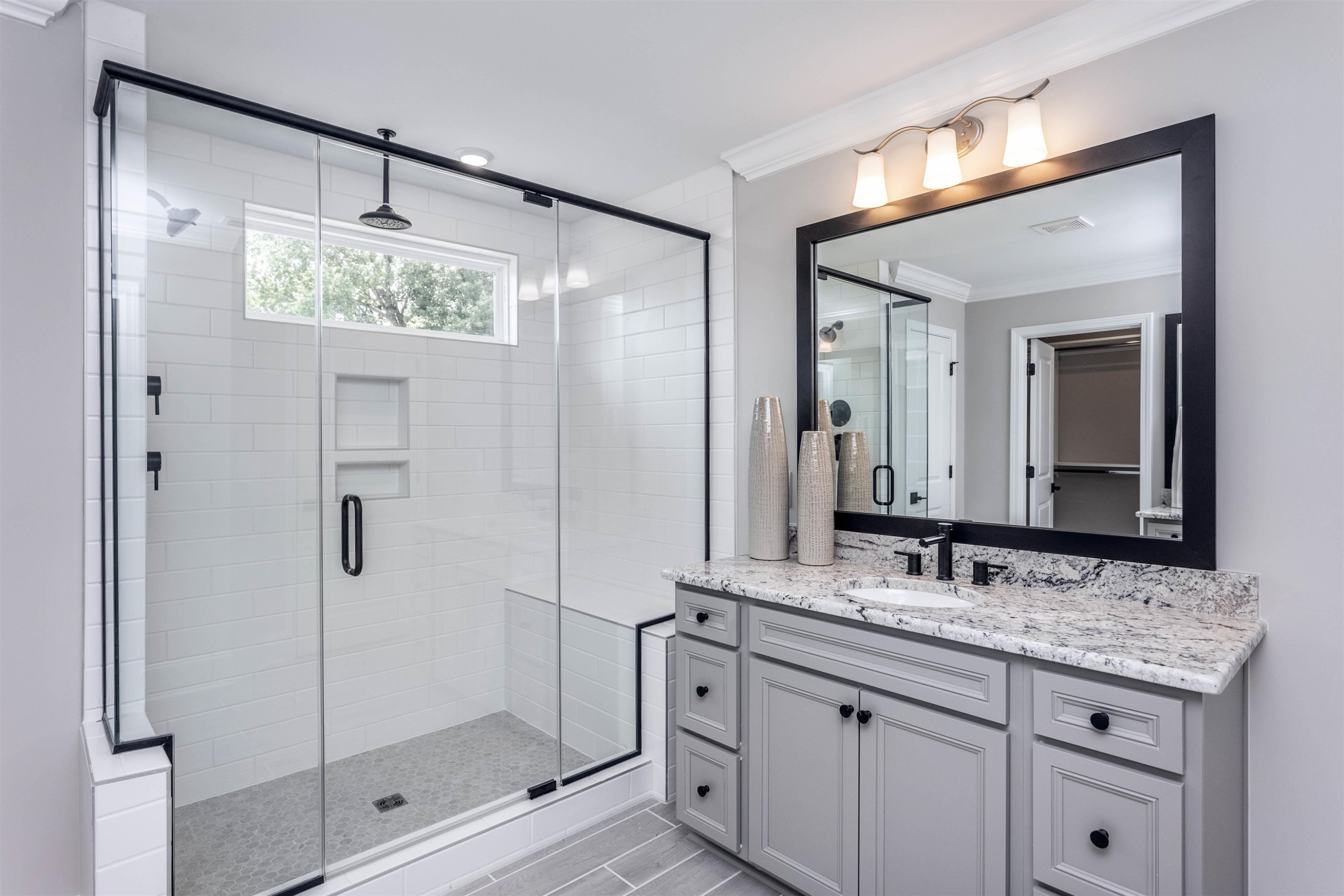 300 Heritage Regency Drive Wake Forest, NC 27587 - Photo 10 of 31 a bathroom with a shower sink and mirror