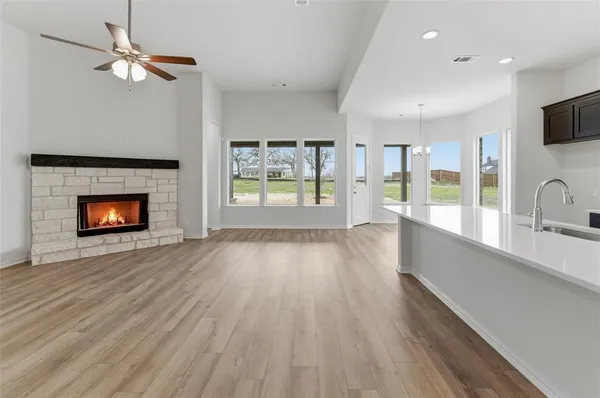 wooden floor in an empty room with a fireplace