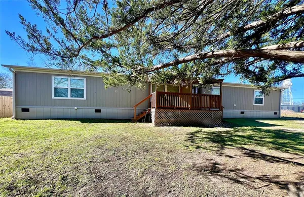 a house with a tree in front of it